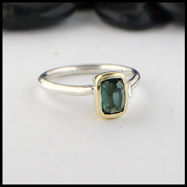 Rustic hand fabricated ring in sterling silver with an 18K yellow gold bezel set with a Rose Cut Blue Green Tourmaline.