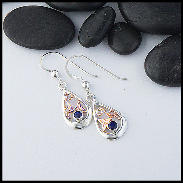 Custom Sterling Silver tear drop earrings with 14K Rose Gold trinity knots and accents, set with a 3mm Sapphire. 