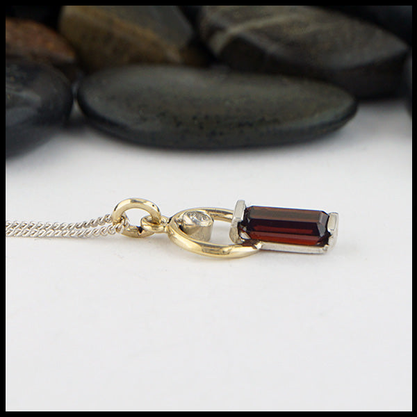 Garnet and Diamond Pendant in silver and gold