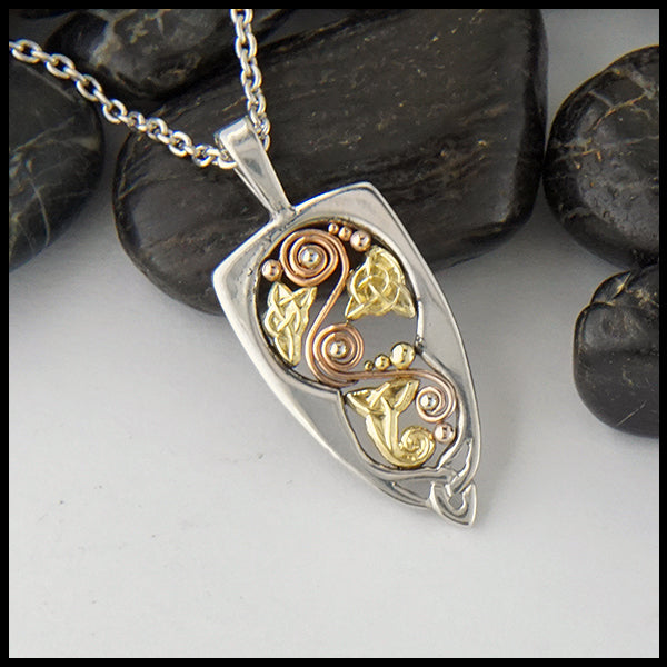 Custom celtic knot pendant in silver and gold