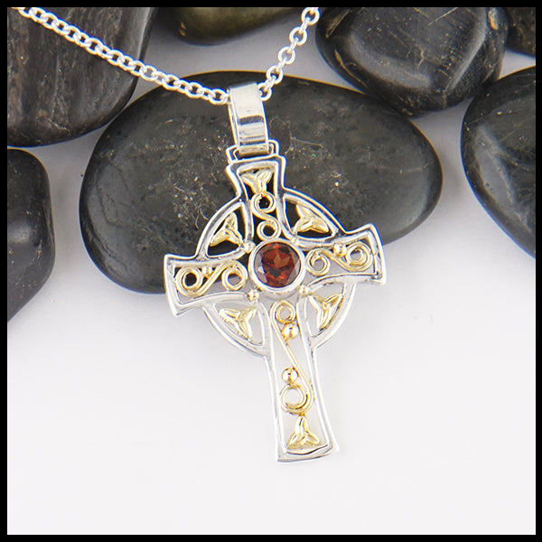 Custom silver and gold cross with garnet
