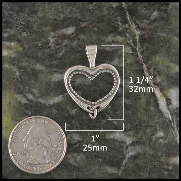 Ornate heart pendant in Sterling Silver measures 1 1/4" by 1"