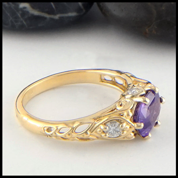 Profile view of purple sapphire and diamond gold ring