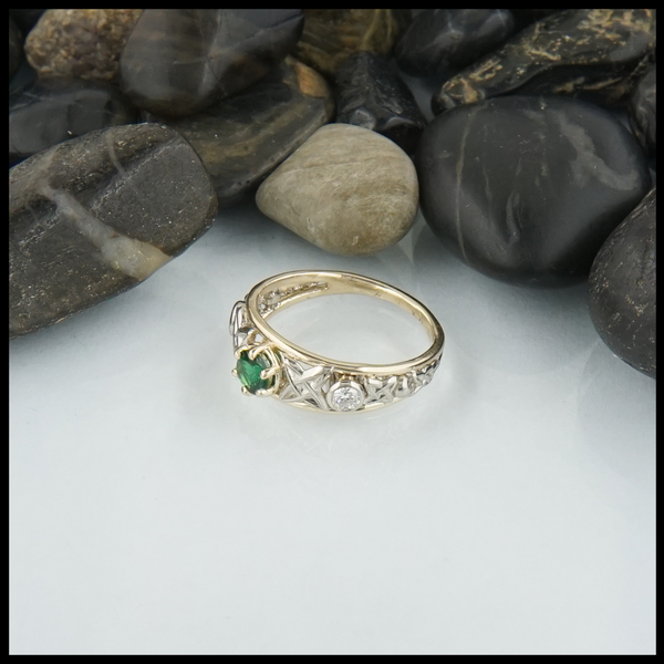 Green Tsavorite custom ring in 14K Yellow and White Gold and set with a Green Tsavorite and 3mm Diamonds.